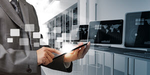 man holding a tablet in computer lab