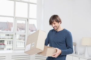 man packing online retail parcel