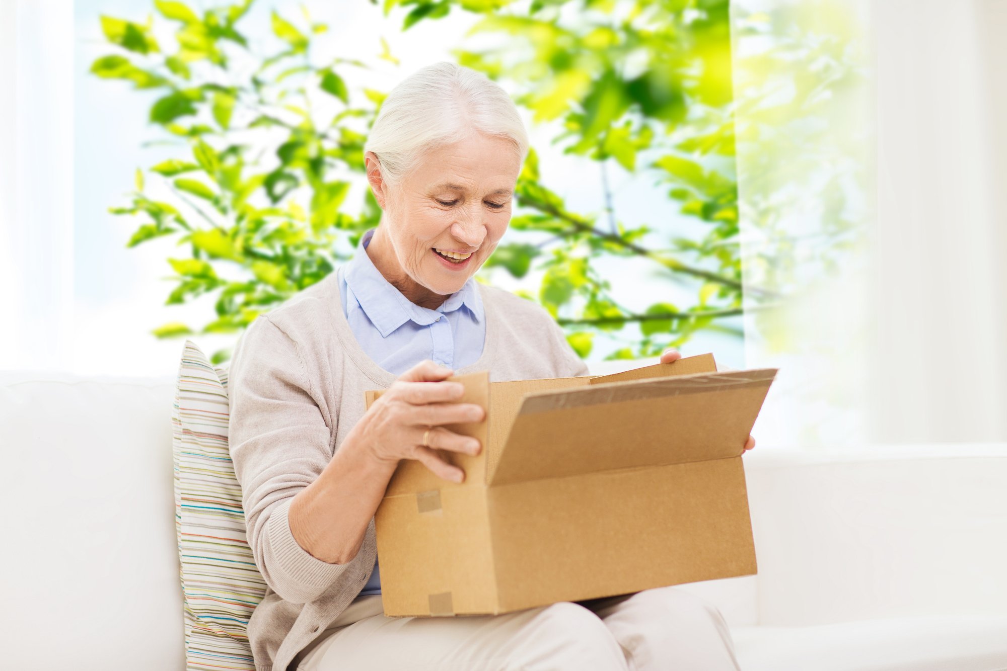 Grandmother delighted to open a care package